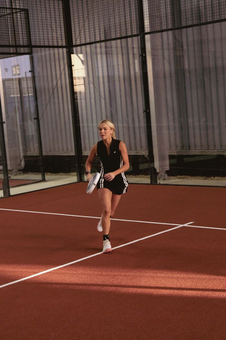 A player moving across the back of the court